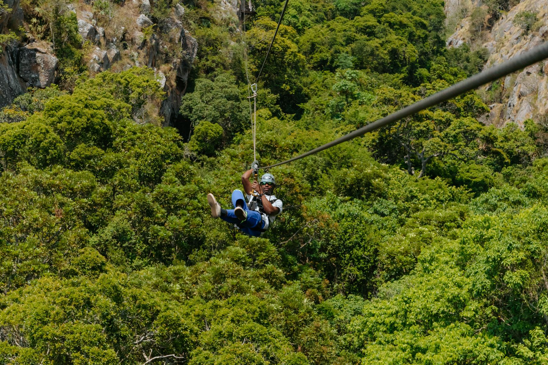 Zip-lining over a forested gorge
